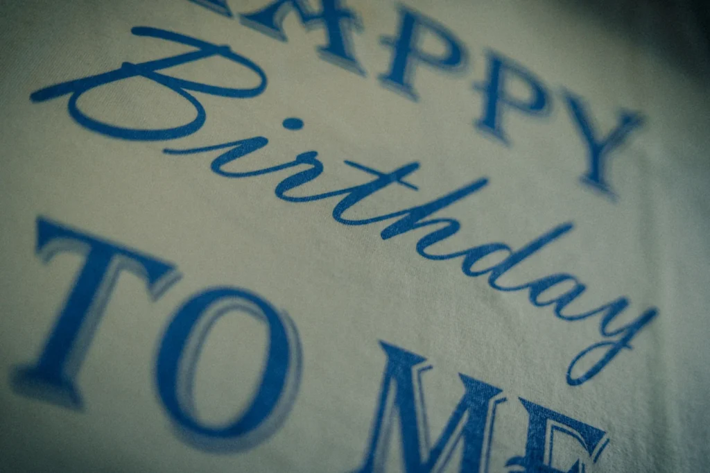 White Jammy Threads t-shirt featuring blue Happy Birthday TO ME text for celebration.