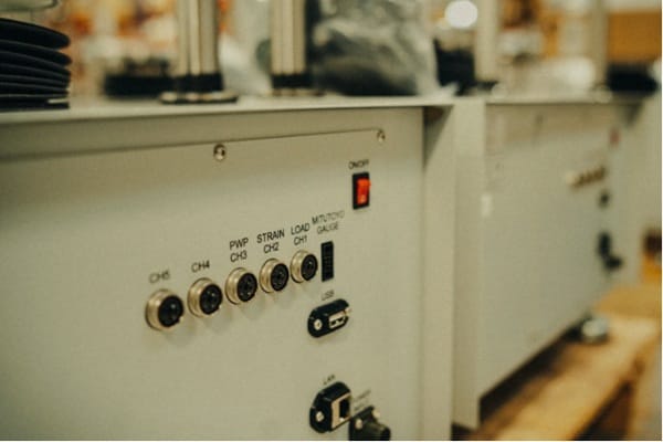 Close-up of industrial printing equipment control panel at Jammy Threads UK studio.