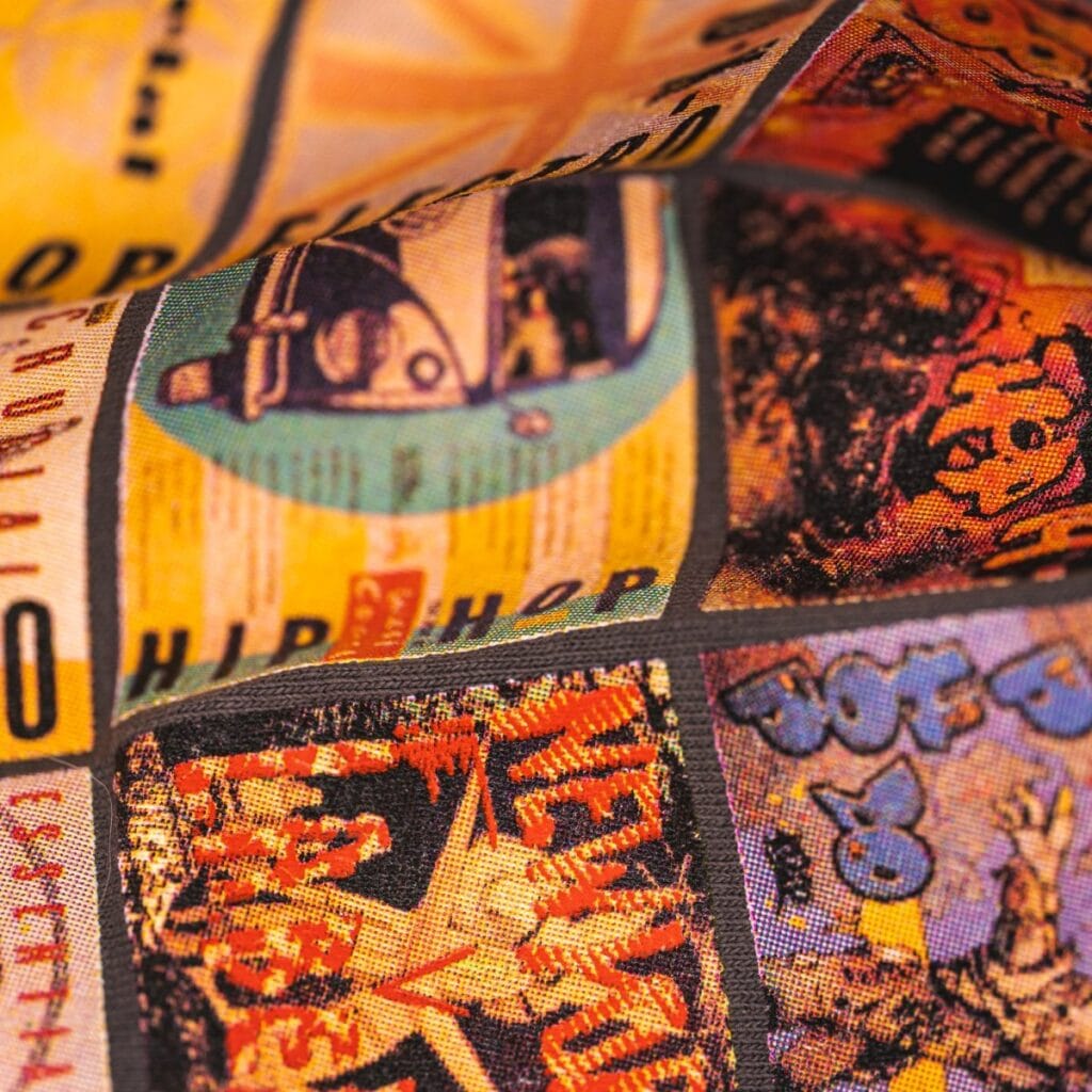 Close-up of Jammy Threads retro fabric with vintage hip hop and New York graphics.